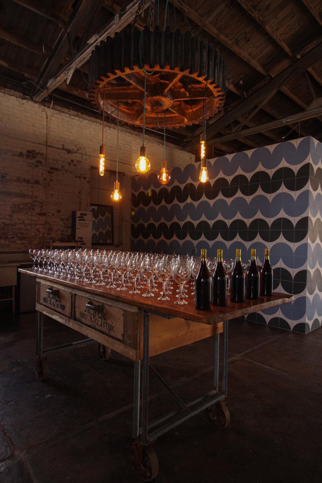 Stampede interior — gear chandelier and wine glasses